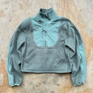 Lululemon Fleece + Ripstop Hiking Pullover in a green colorway.